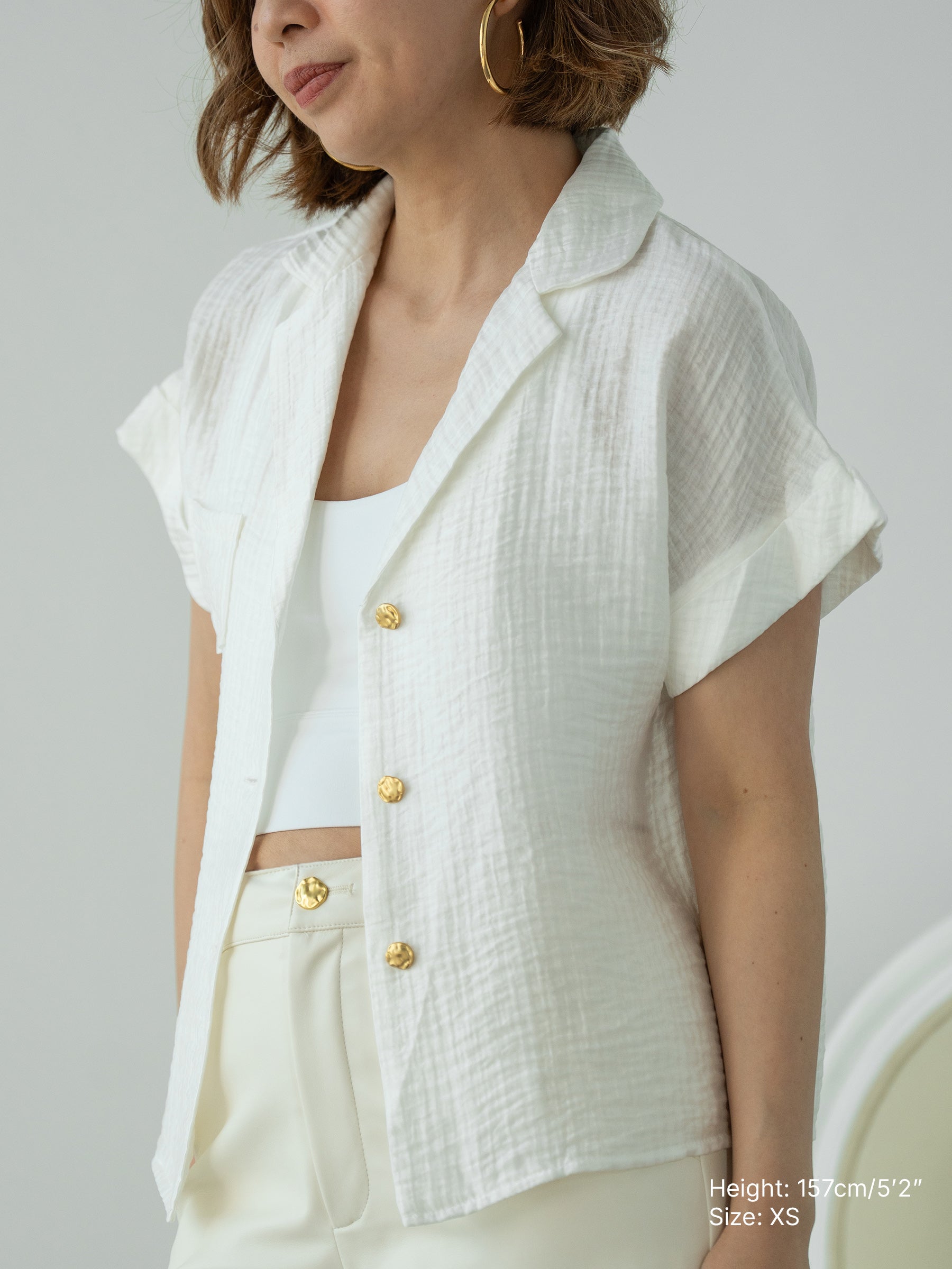 Women's white soft breathable shirt with gold buttons