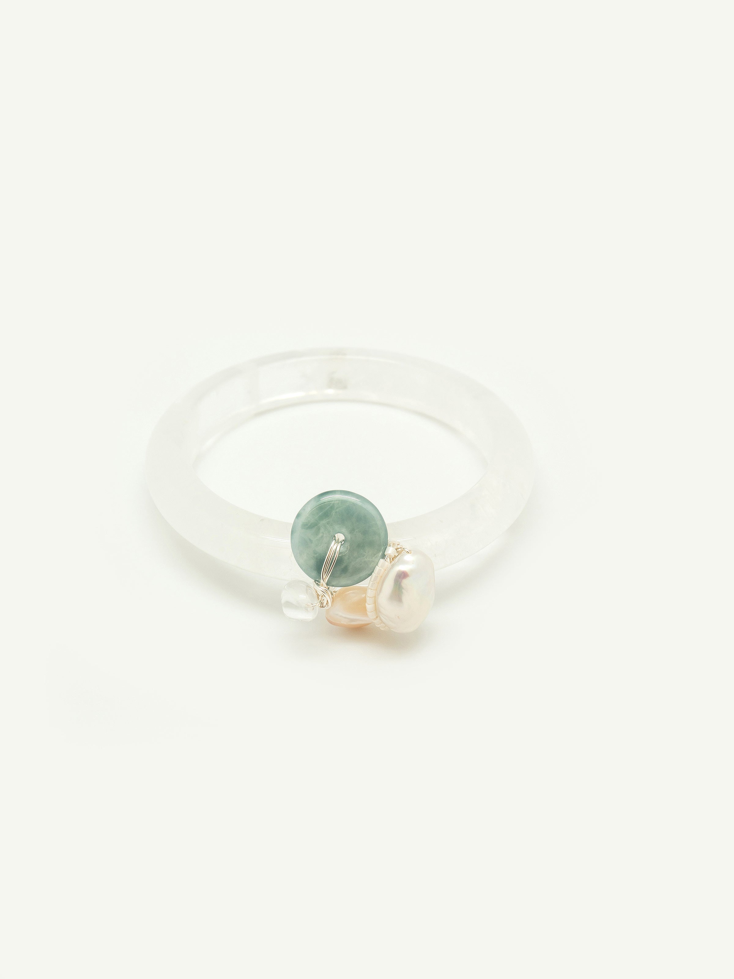 Quartz bangle with jade doughnut, keshi pearl, clear quartz, mother of pearl, toho seed beeds. One of a kind.