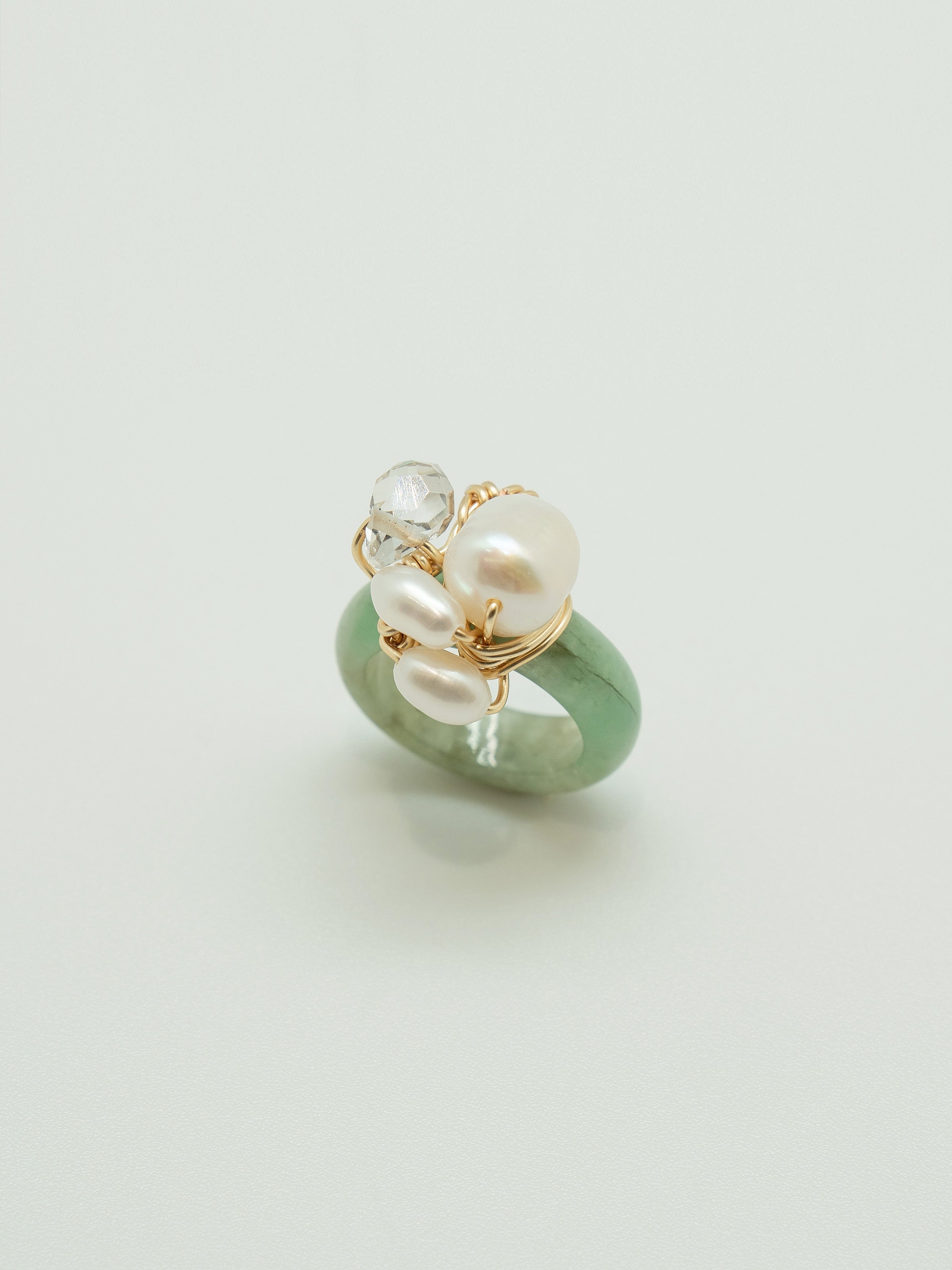 One of a kind jade ring with a trio of pearls and clear crystal.