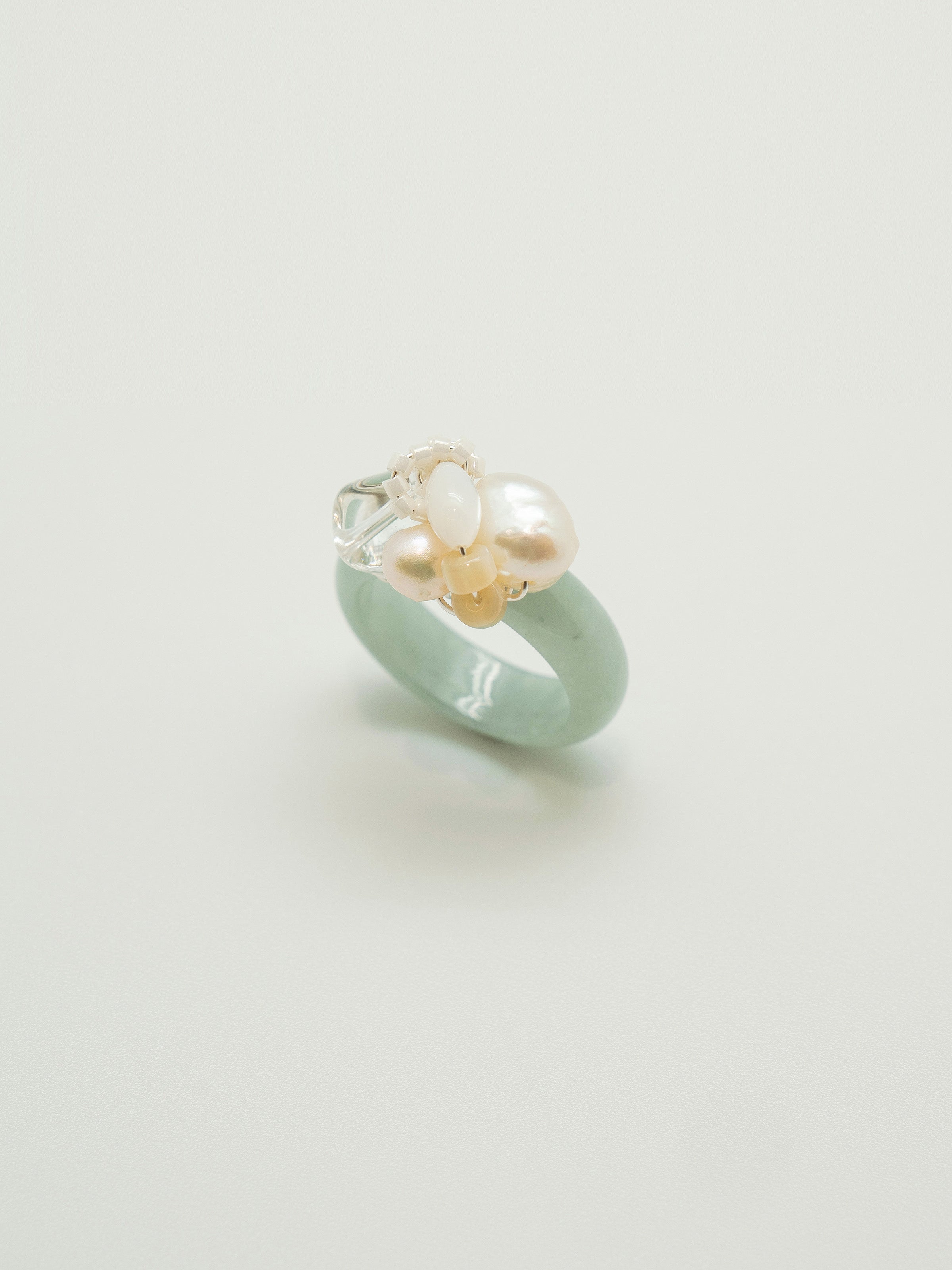 One of a kind jade ring with pearls, clear quartz, mother of pearl, white agate, seed beads.