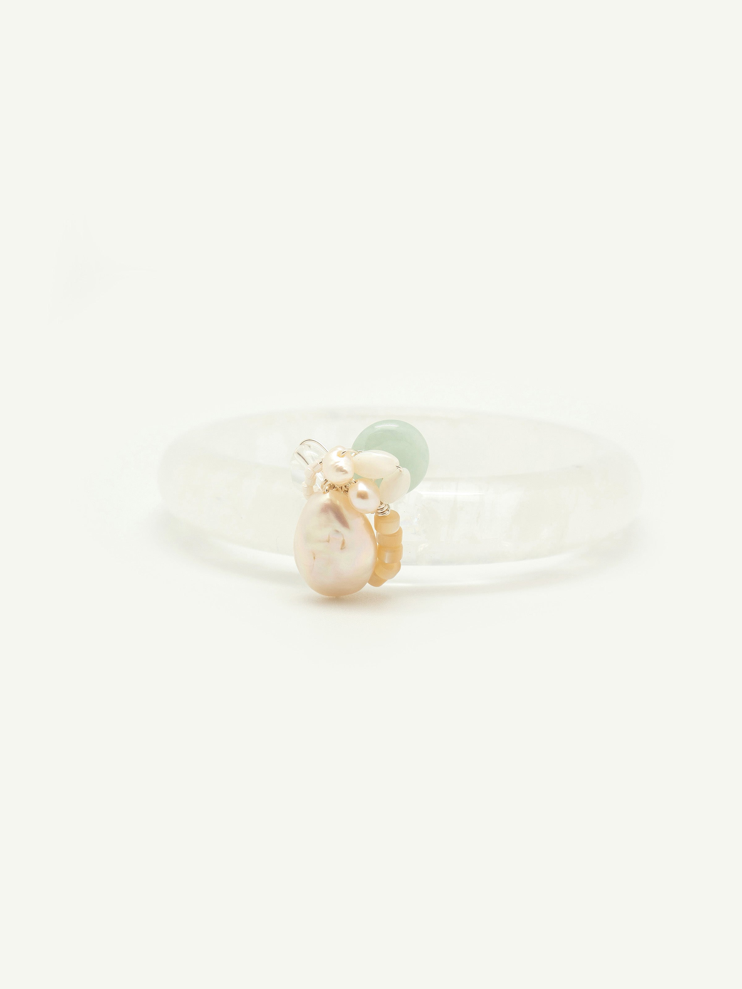 Quartz bangle with jade doughnut, keshi pearl, freshwater pearl, mother of pearl, toho seed beads. One of a kind.