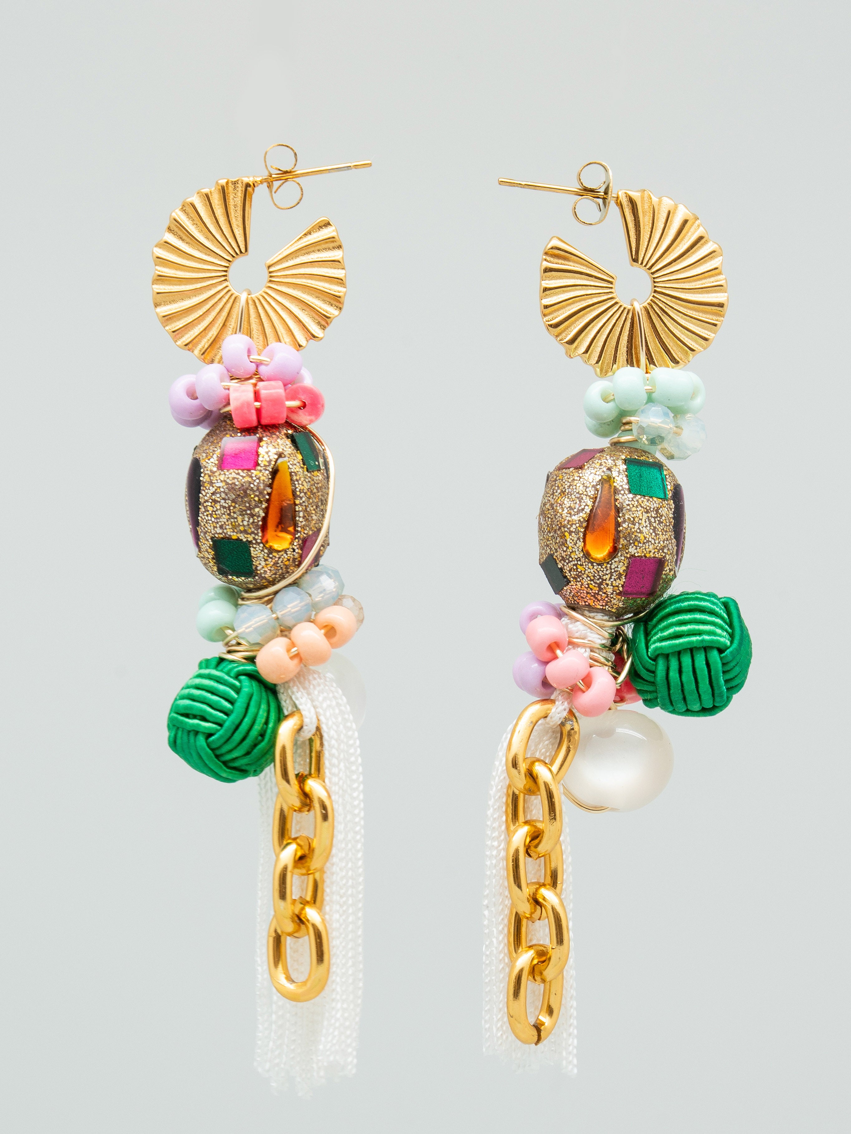 Colourful women's earrings with multicolour seed beads, swarovski crystals, gold chains, and white tassels.