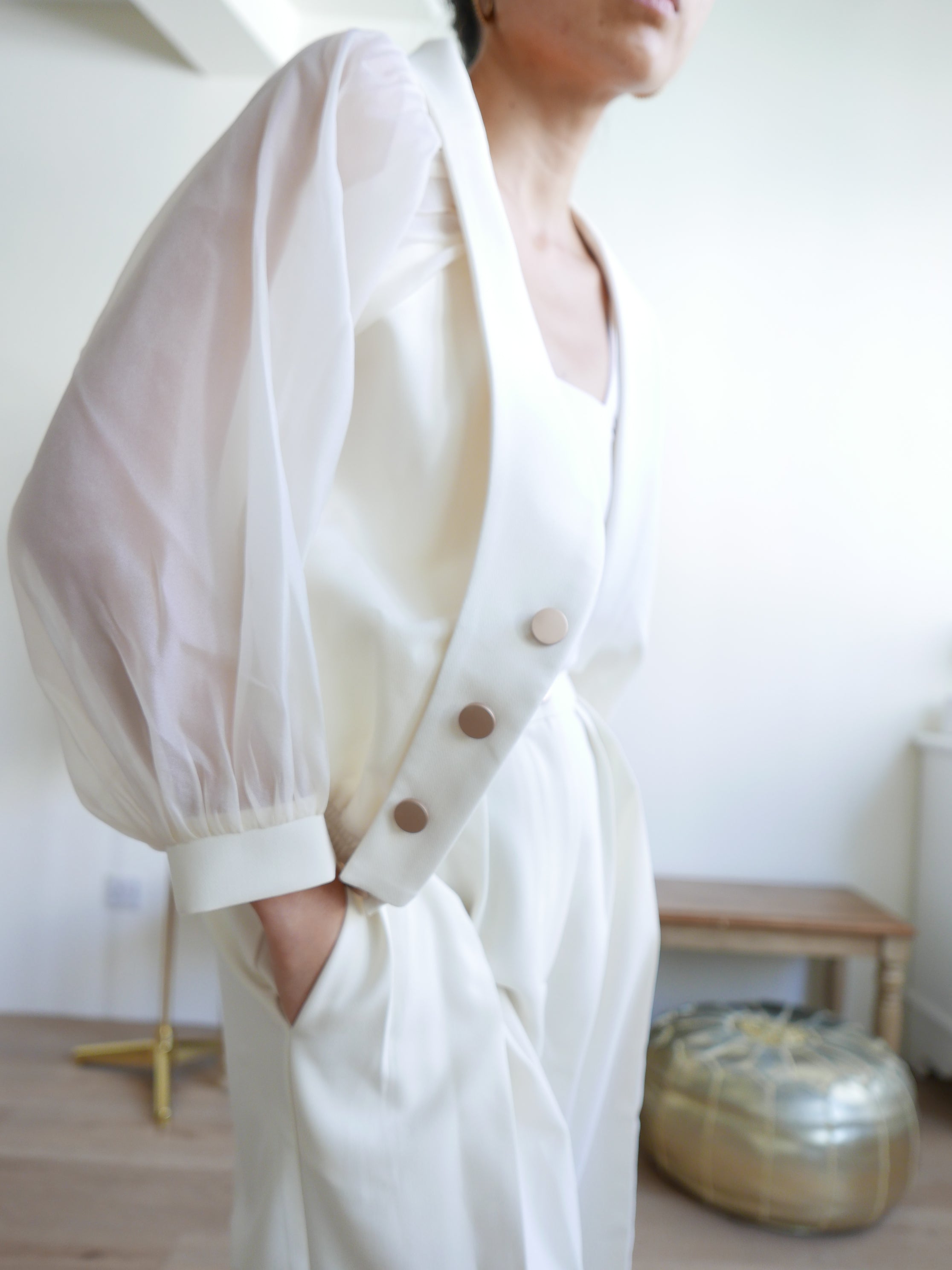 Women's white multiway off-shoulder top or outerwear blazer with gold buttons