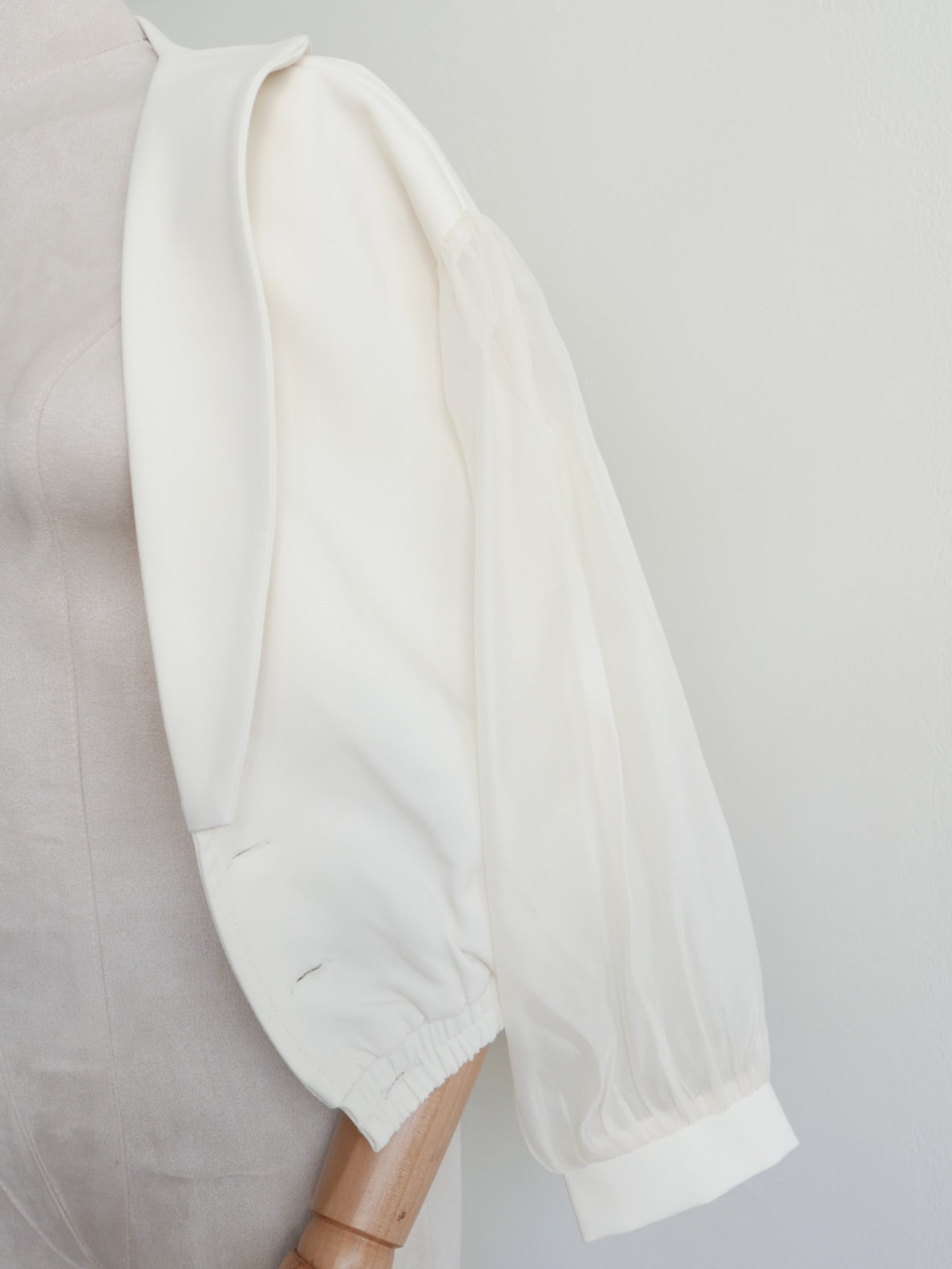 Women's white multiway off-shoulder top or outerwear blazer with gold buttons