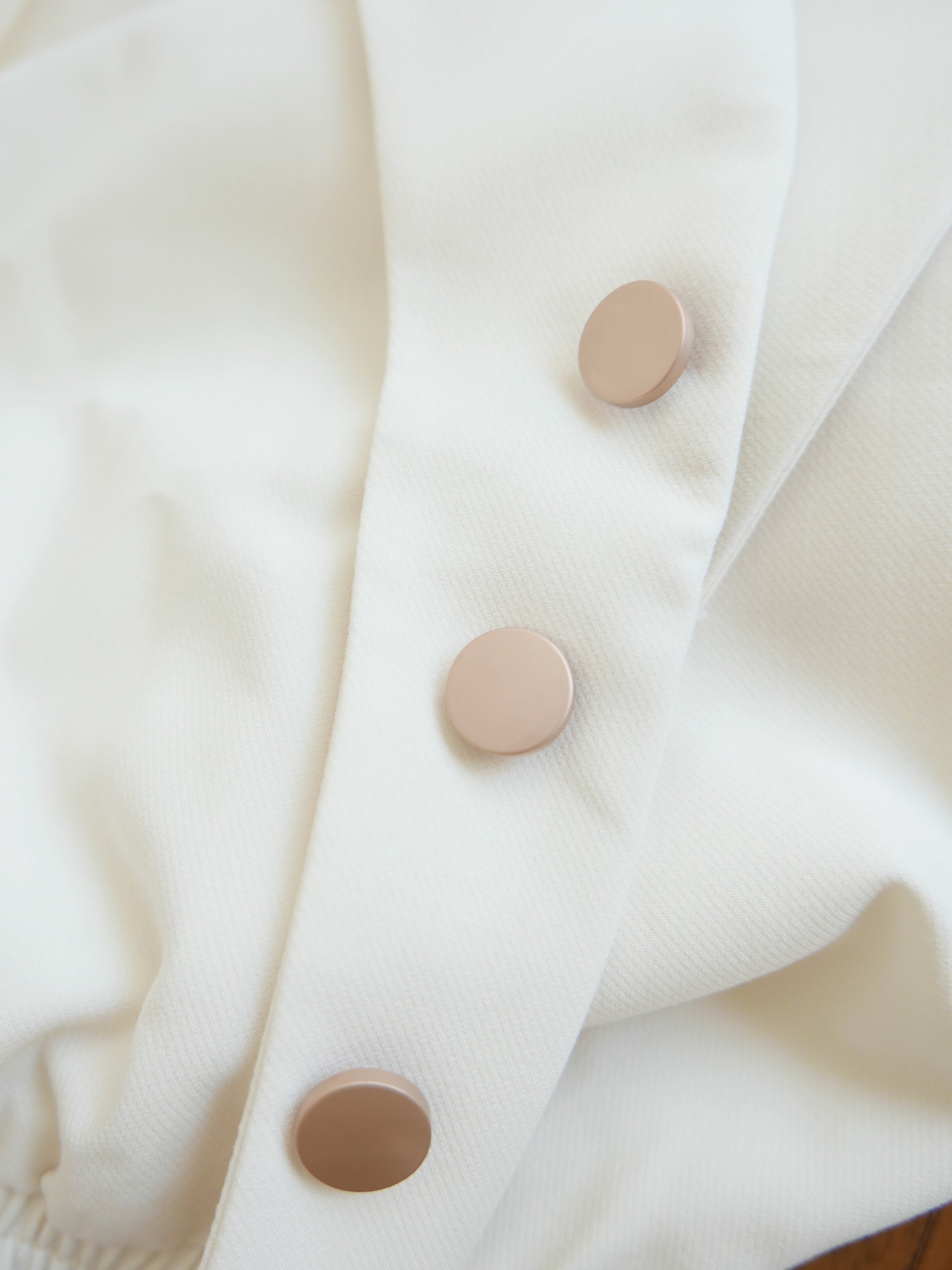 Women's white multiway off-shoulder top or outerwear blazer with gold buttons