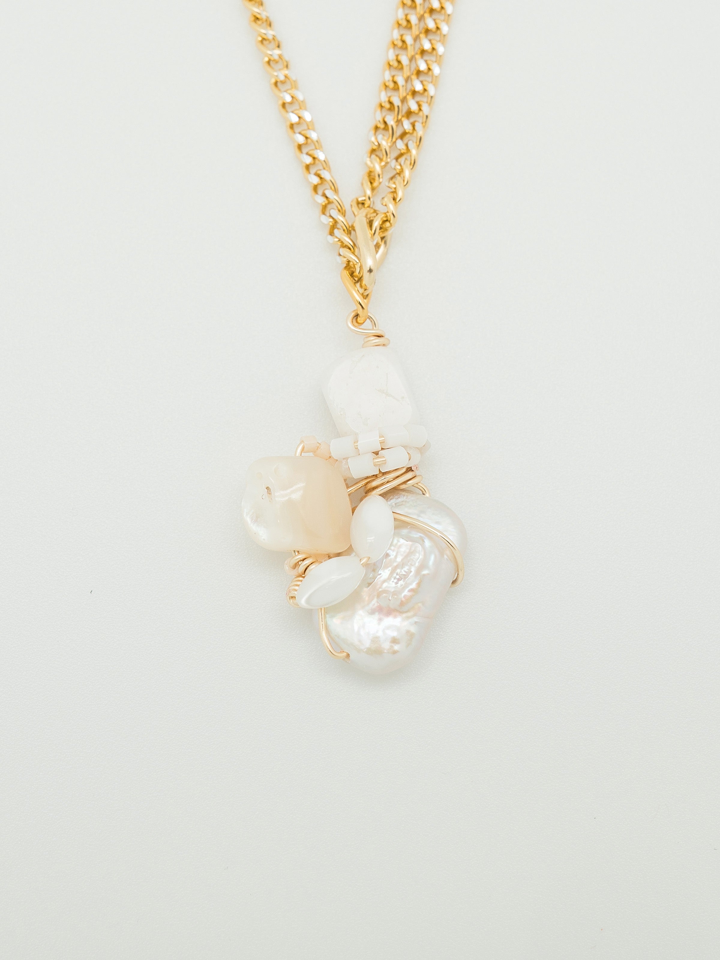 One of a kind necklace with freshwater pearl, white agate, and mother of pearl.
