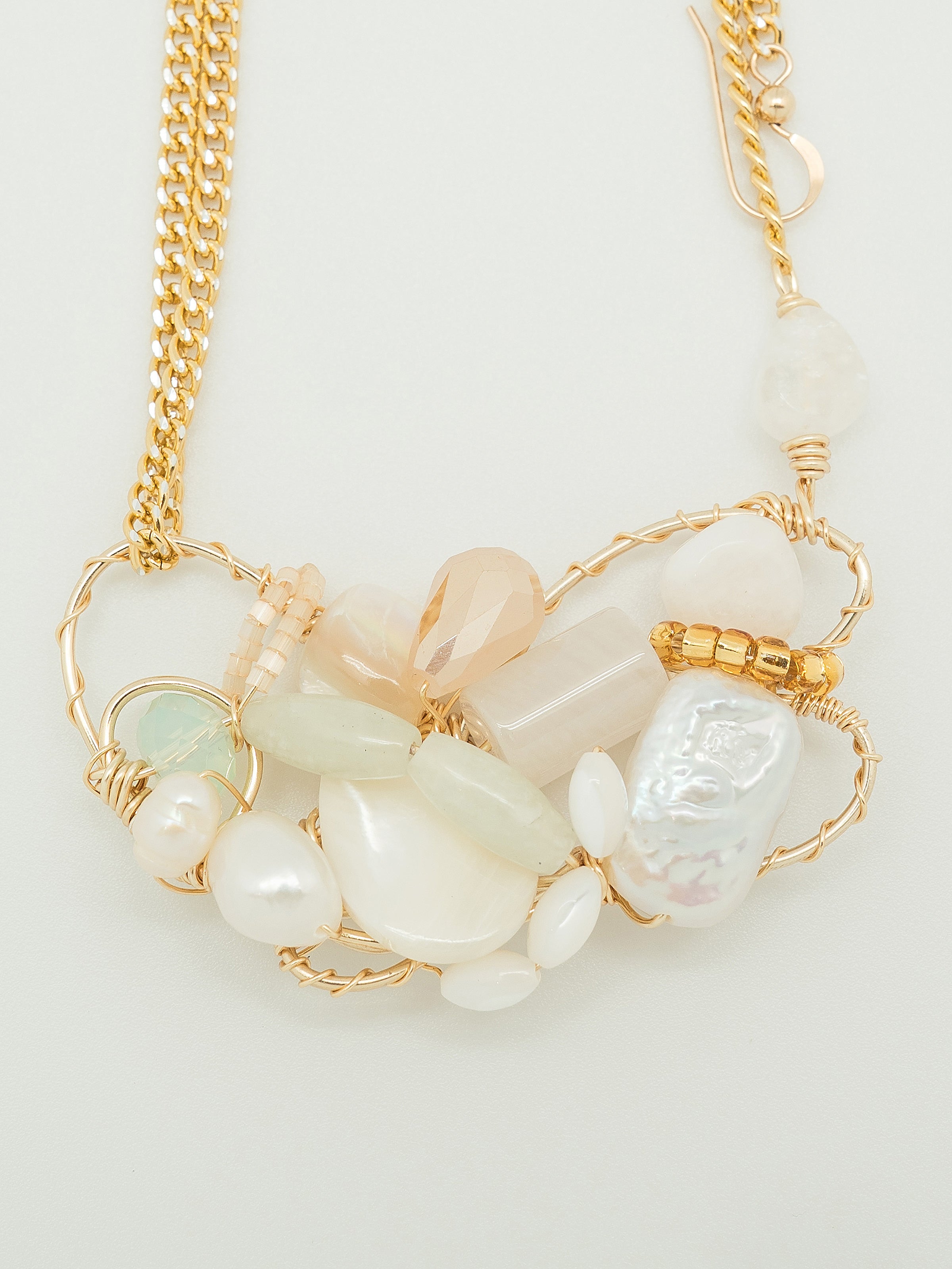 One of a kind necklace with freshwater pearls, swarovski crystal, white agate, quartz, toho seed beeds, and aluminium chain.
