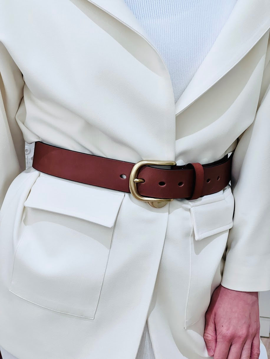 Women's bespoke high waisted belt with gold brass buckle, made with genuine tan brown leather.