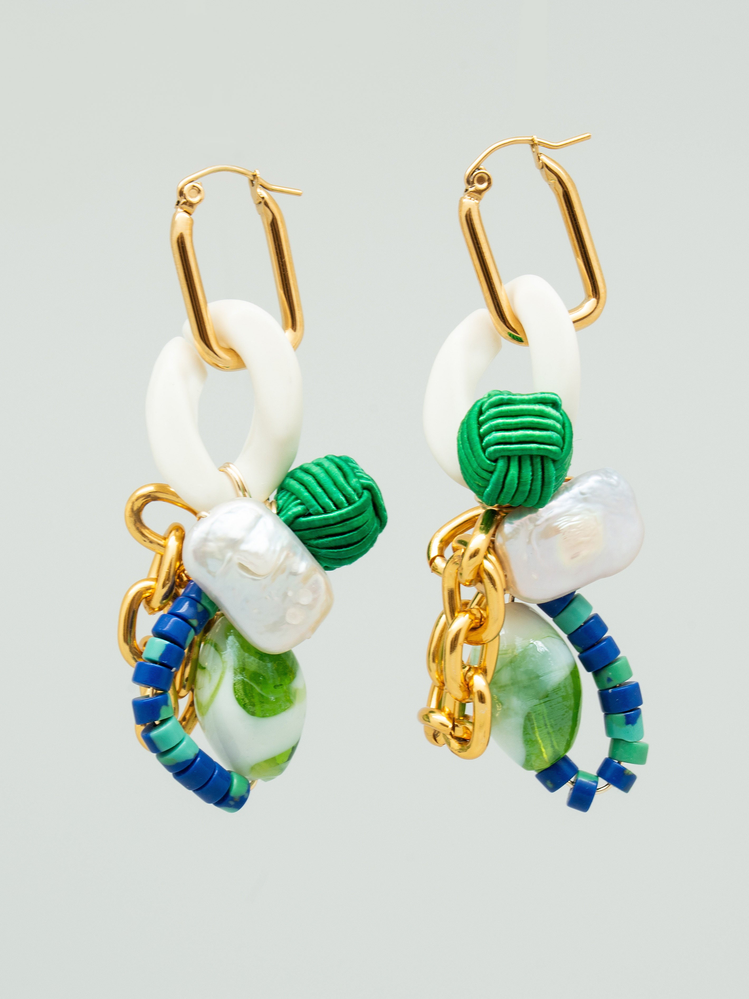Pair of earrings with gold, green, and blue accents, freshwater pearls, and chain links