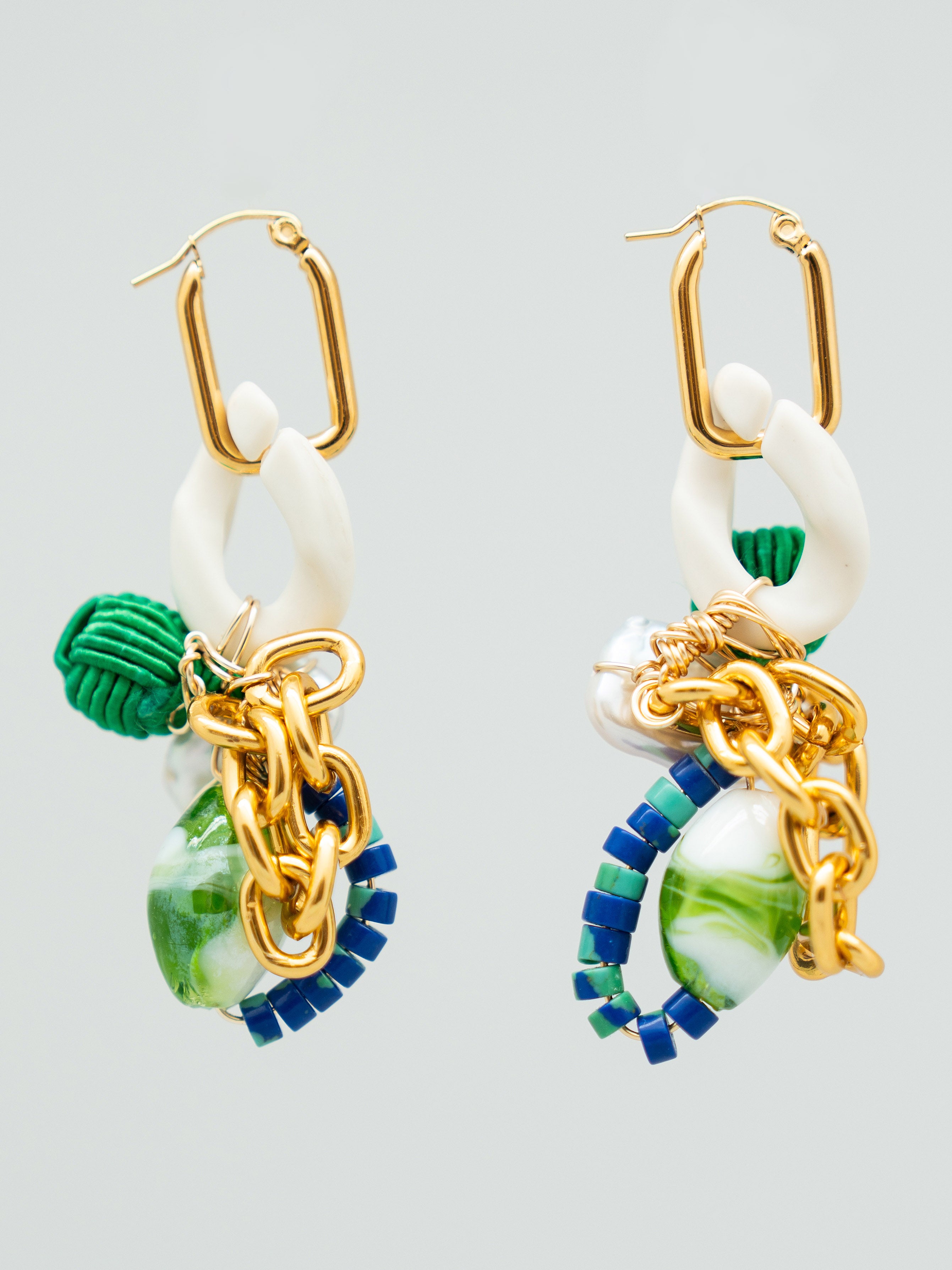 Pair of earrings with gold, green, and blue accents, freshwater pearls, and chain links
