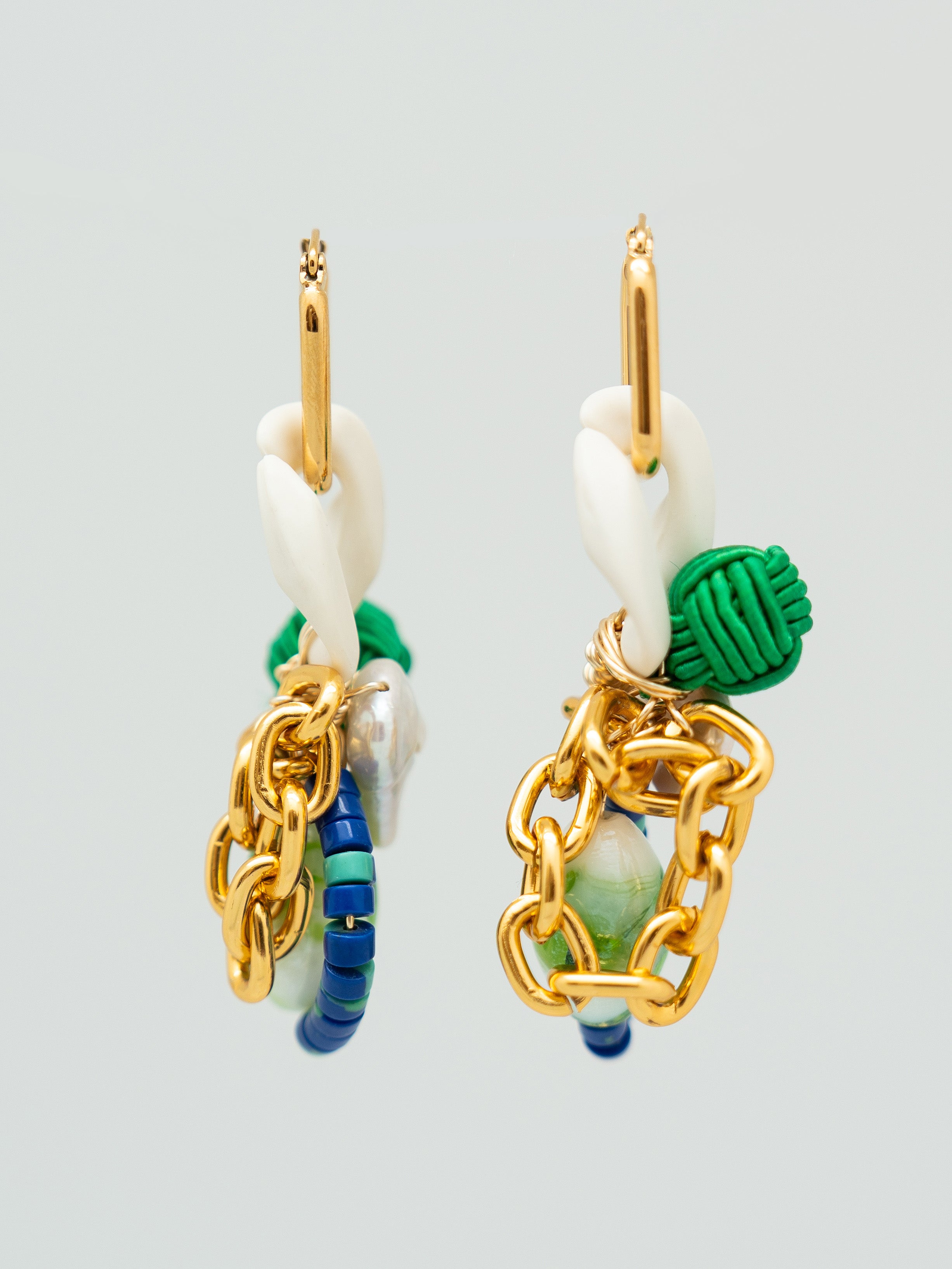 Pair of earrings with gold, green, and blue accents, freshwater pearls, and chain links
