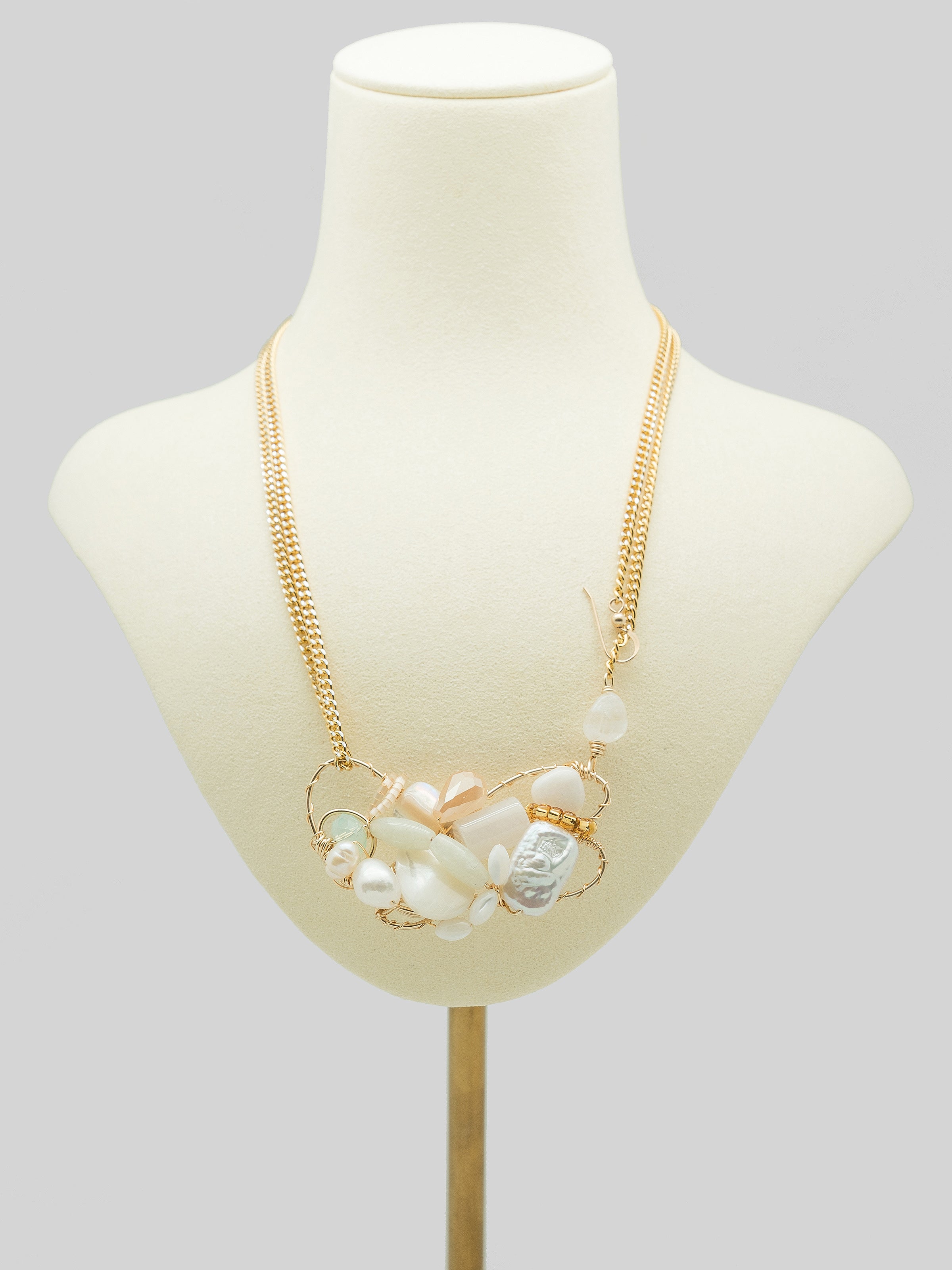 One of a kind necklace with freshwater pearls, swarovski crystal, white agate, quartz, toho seed beeds, and aluminium chain.